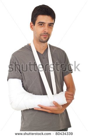 Portrait Of Young Man With Broken Hand In Gypsum Isolated On White