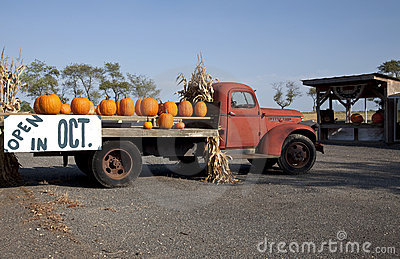On An Old Red Farm Truck With A Sign Advertising That The Farm