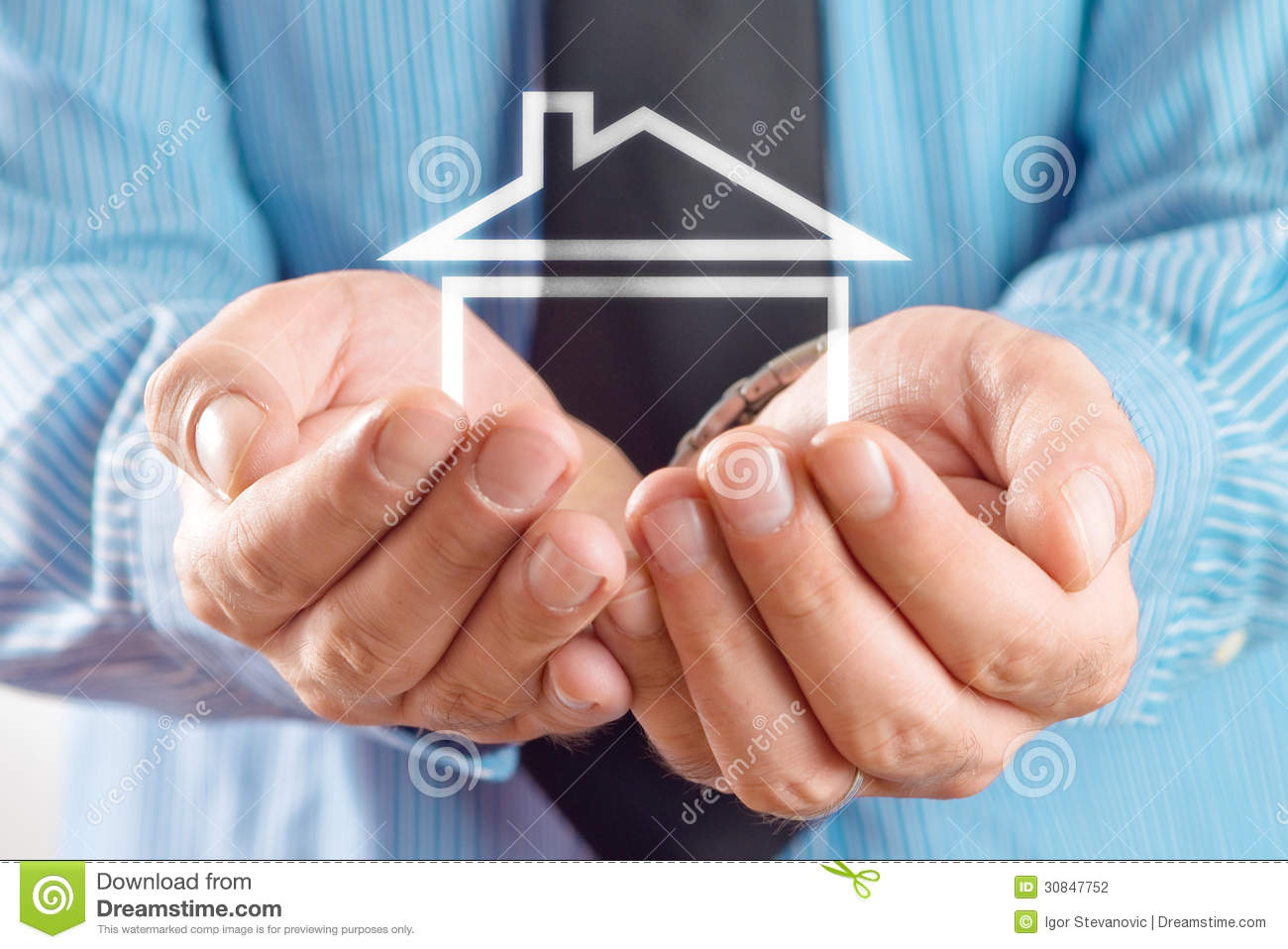 Agent Holding House In Cupped Hands  House Selling Or Home Insurance