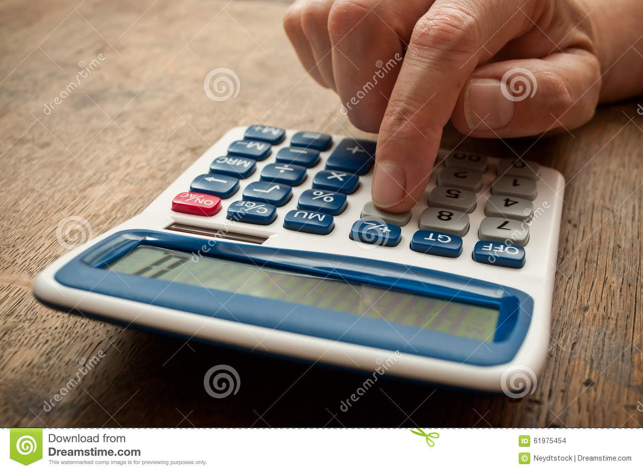 Closeup Oh Hand With Calculator On Wooden Desk Background