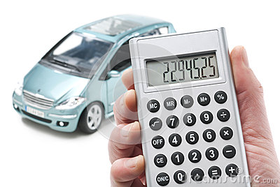 Hand With Calculator And A Car In The Background