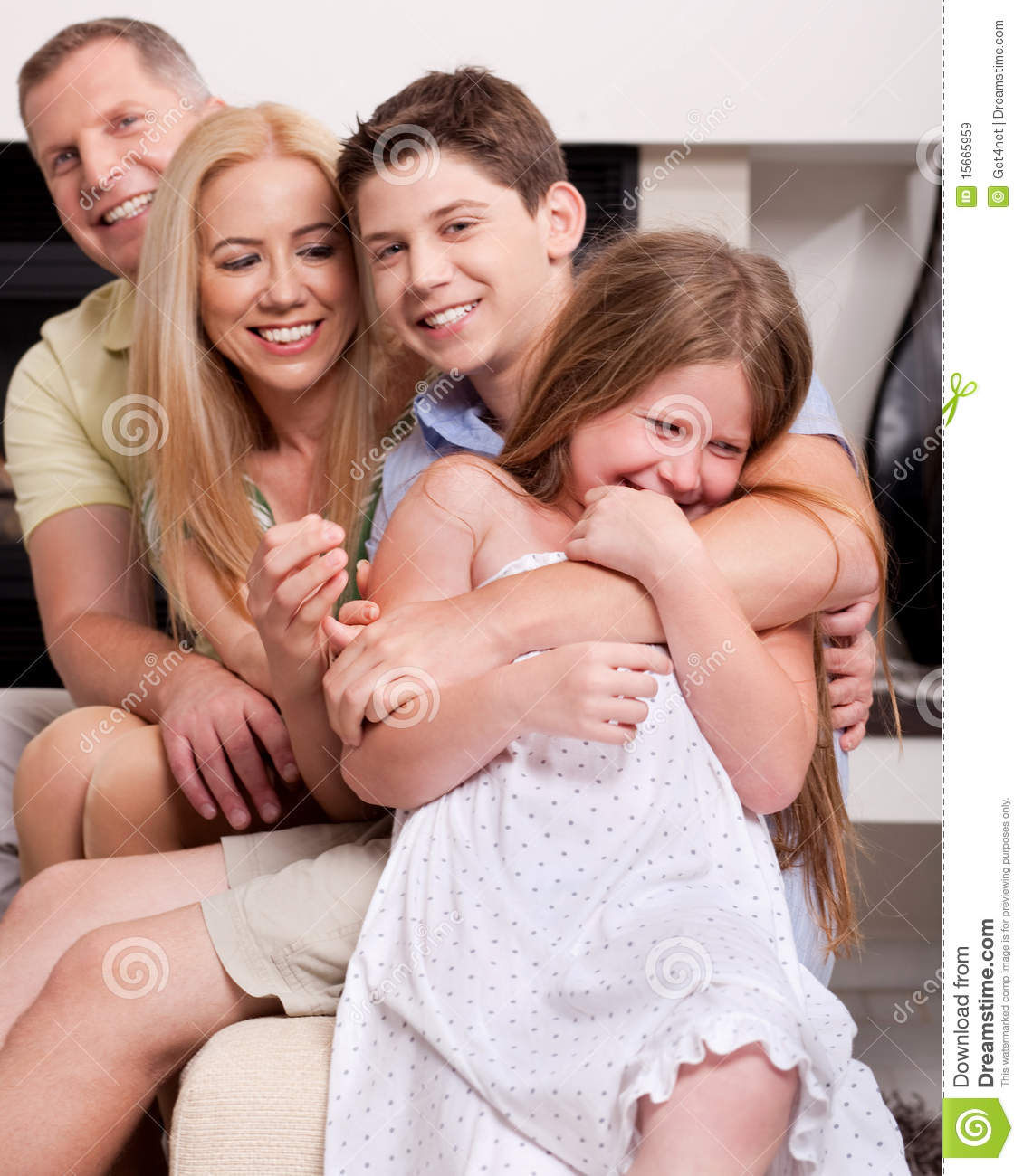 Happy Family Sitting In Straight And Having Fun Royalty Free Stock