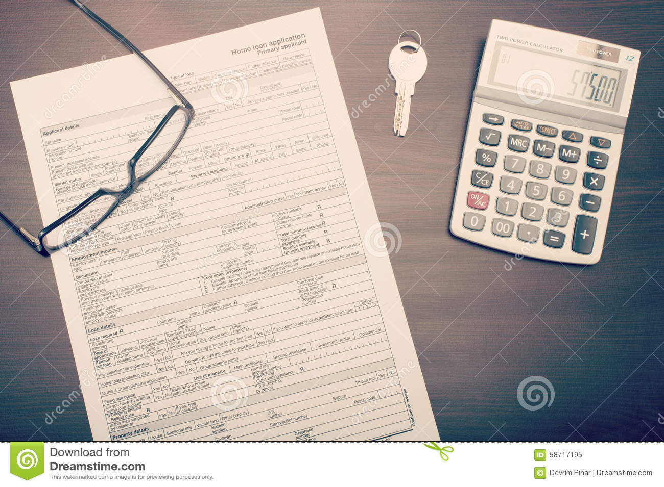 Home Loan Application Form On Desk With Glasses Key And Calculator