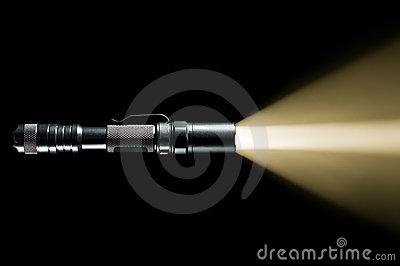    Military Flashlight On Black Background With Visible Beam Of Light