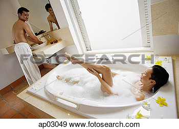 Stock Photograph   Couple In Bathroom Woman In Bath Washing Leg Man