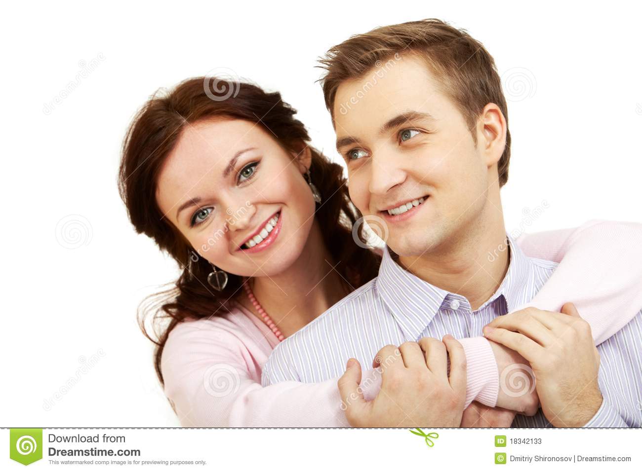 Young Girl Embracing Her Boyfriend Looking At Camera And Smiling