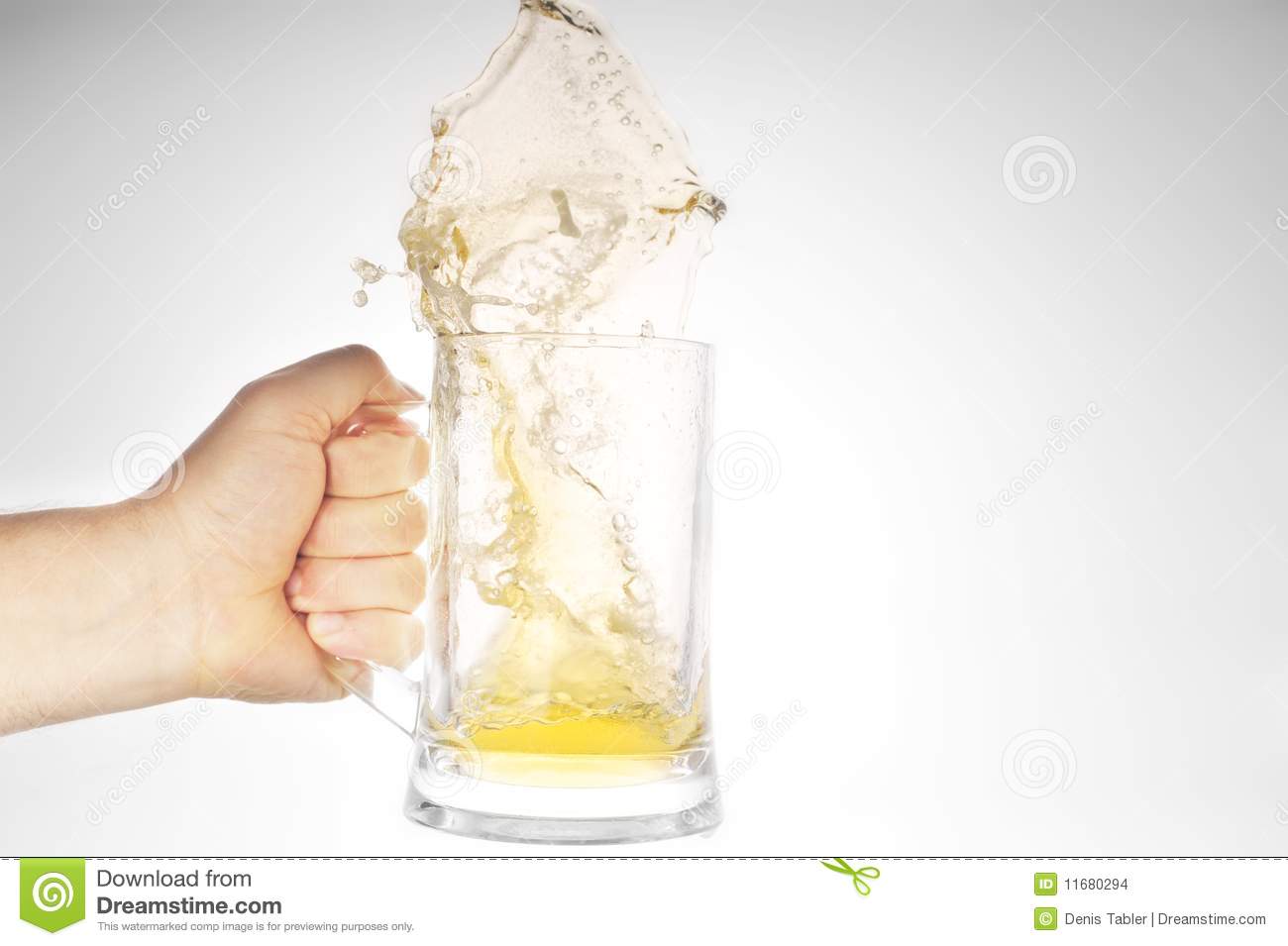 Hand Holding Mug With Splashing Beer Stock Images   Image  11680294