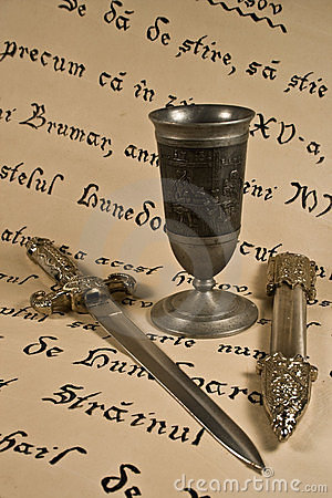 Medieval Dagger With Case And A Metal Goblet Placed On A Hrisov 