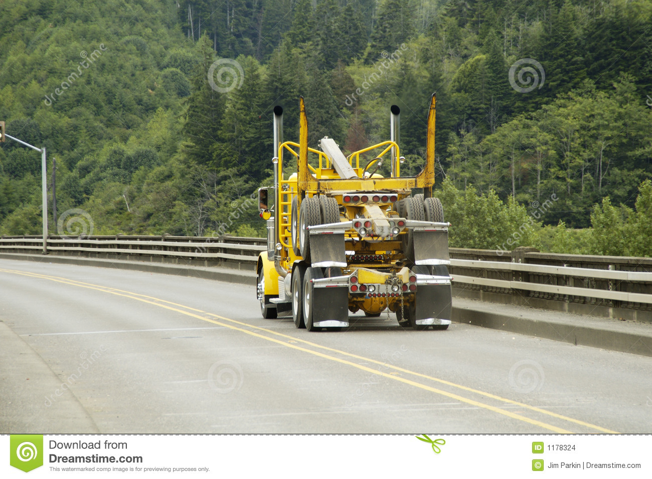 An Empty Logging Truck In Transit From The Sawmill To The Forest