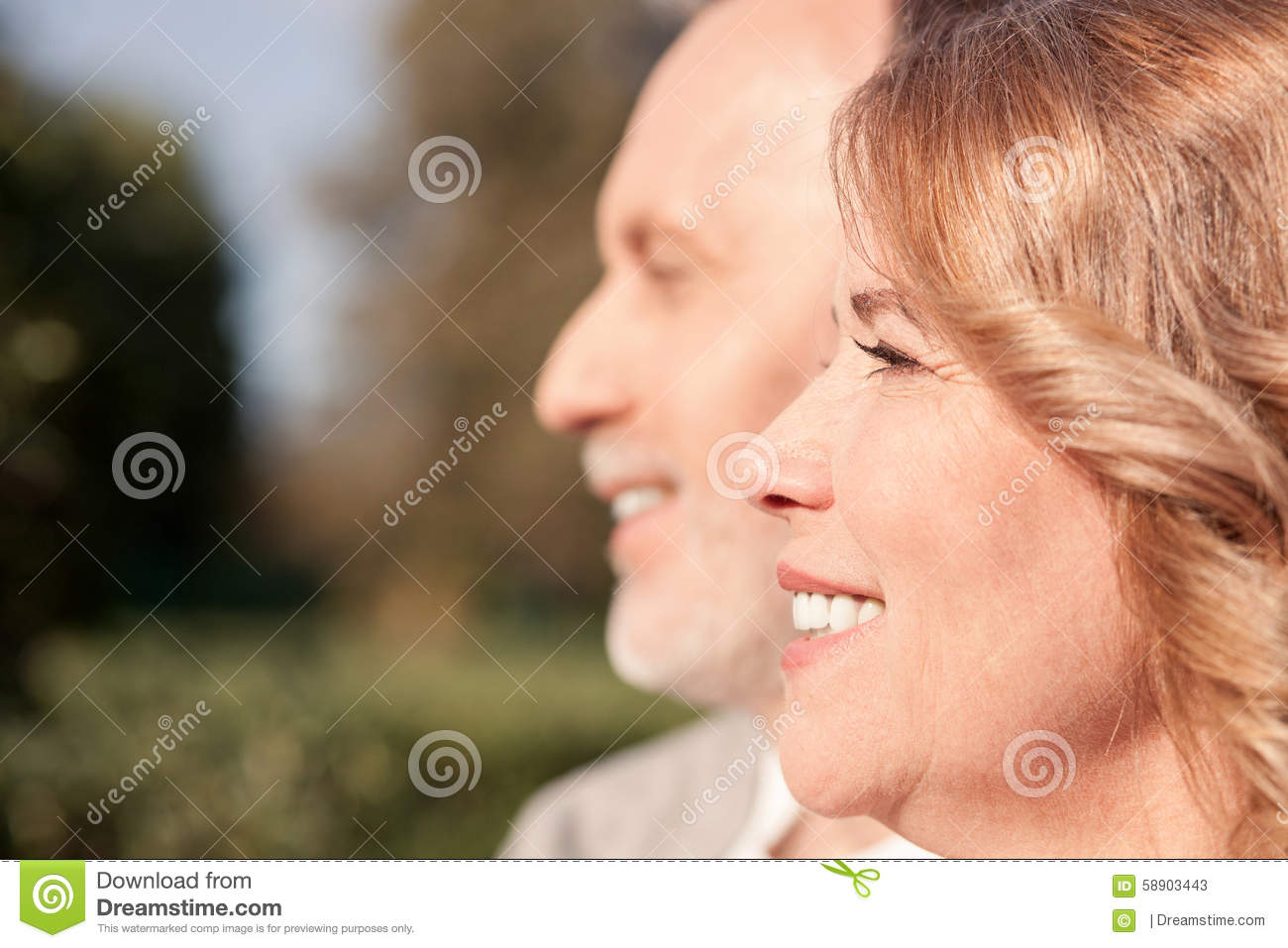 Cheerful Old Married Couple Are Sitting In Park And Relaxing  They Are    