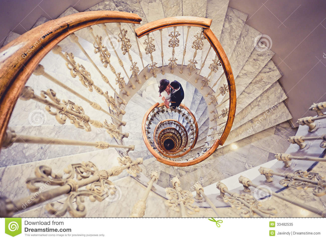 Just Married Couple In A Spiral Staircase Royalty Free Stock Photo
