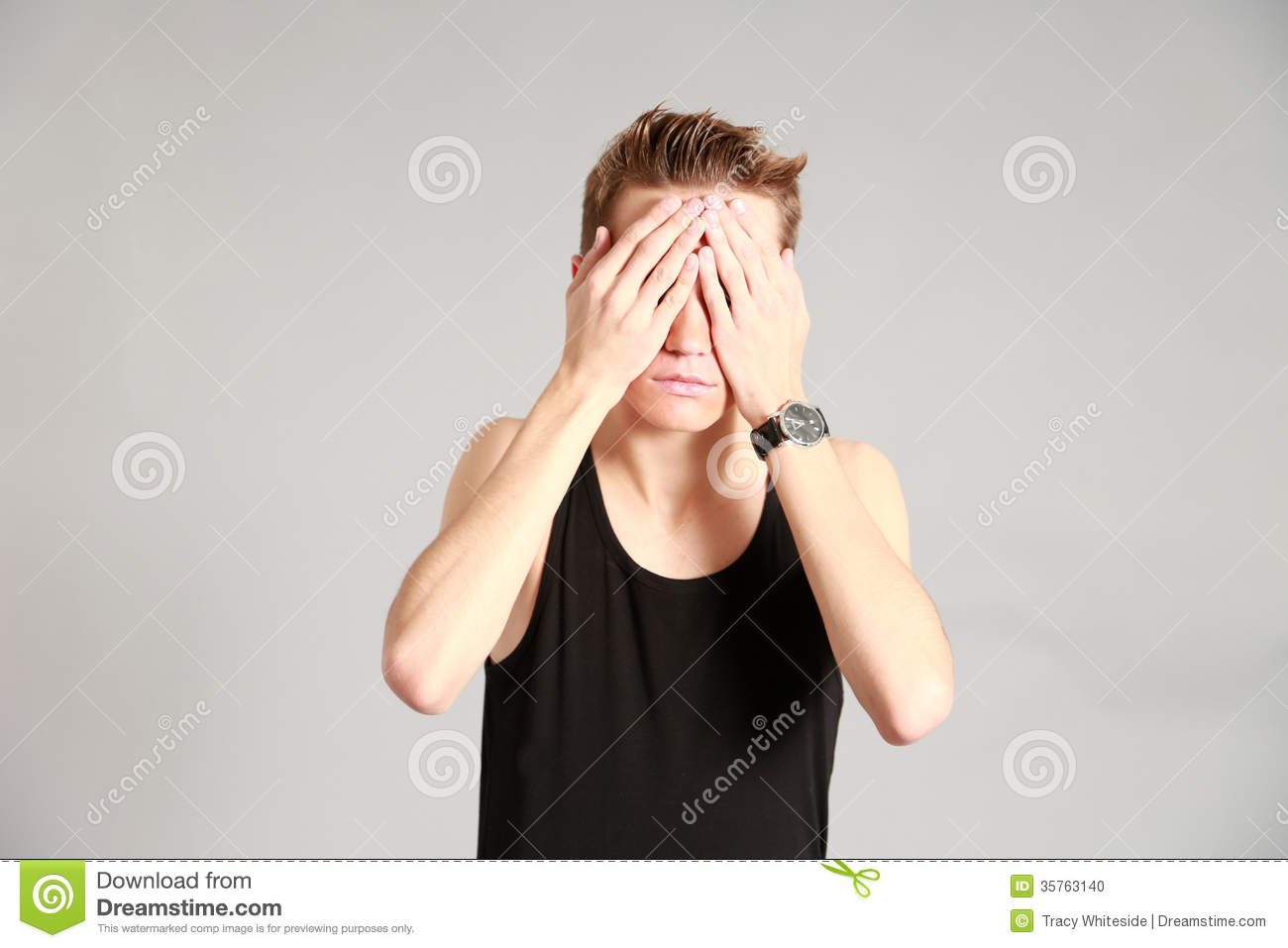 Male Model Covering Eyes With Hands Stock Photo   Image  35763140