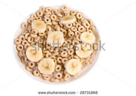 Bowl Of Toasted Oats Cereal With Bananas Forming A Smiley Face    
