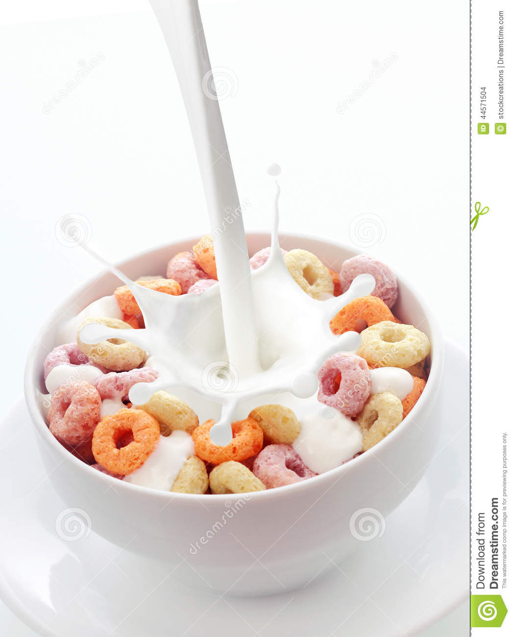 Fresh Creamy Milk Into A Bowl Of Colorful Fruit Loops Breakfast Cereal    