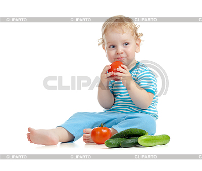 Happy Child Eating Tomatoes  Healthy Food Eating Concept     Andrey