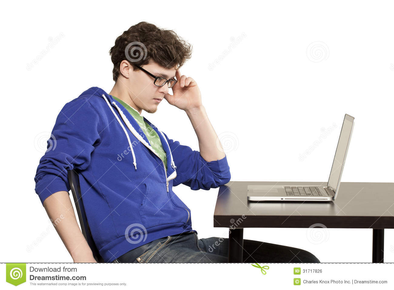 Student Sitting At Table Using Computer Royalty Free Stock Image