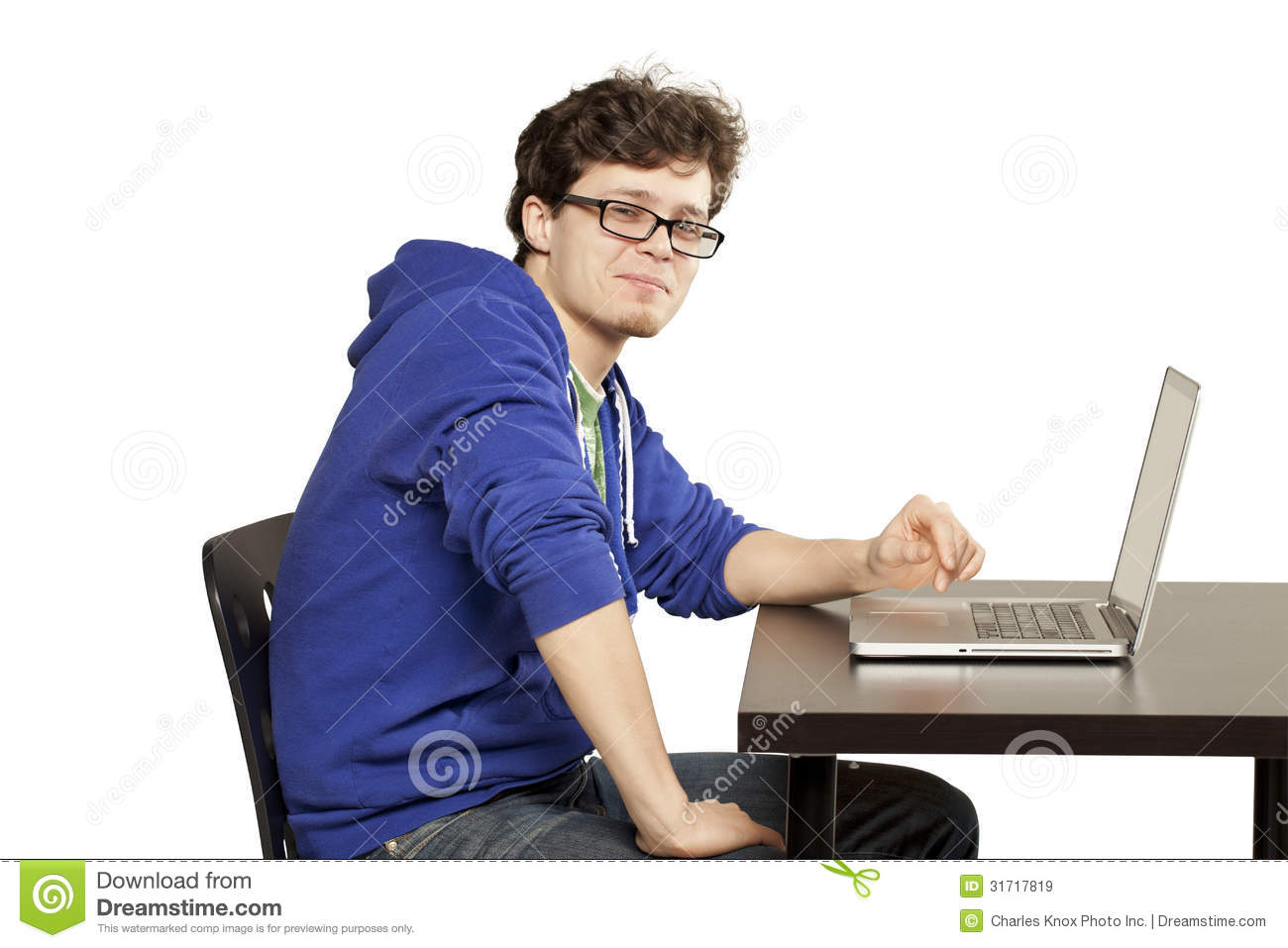 Student Sitting At Table Using Computer Royalty Free Stock Images