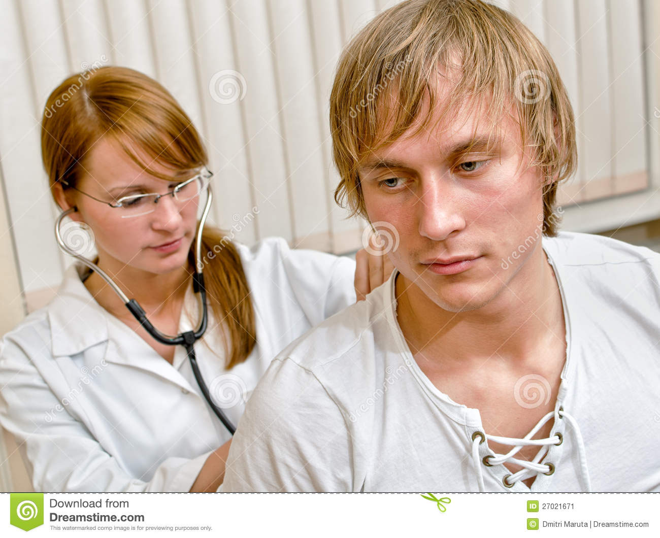 Young Female Doctor Examine Male Patient With Stethoscope  Focus On    