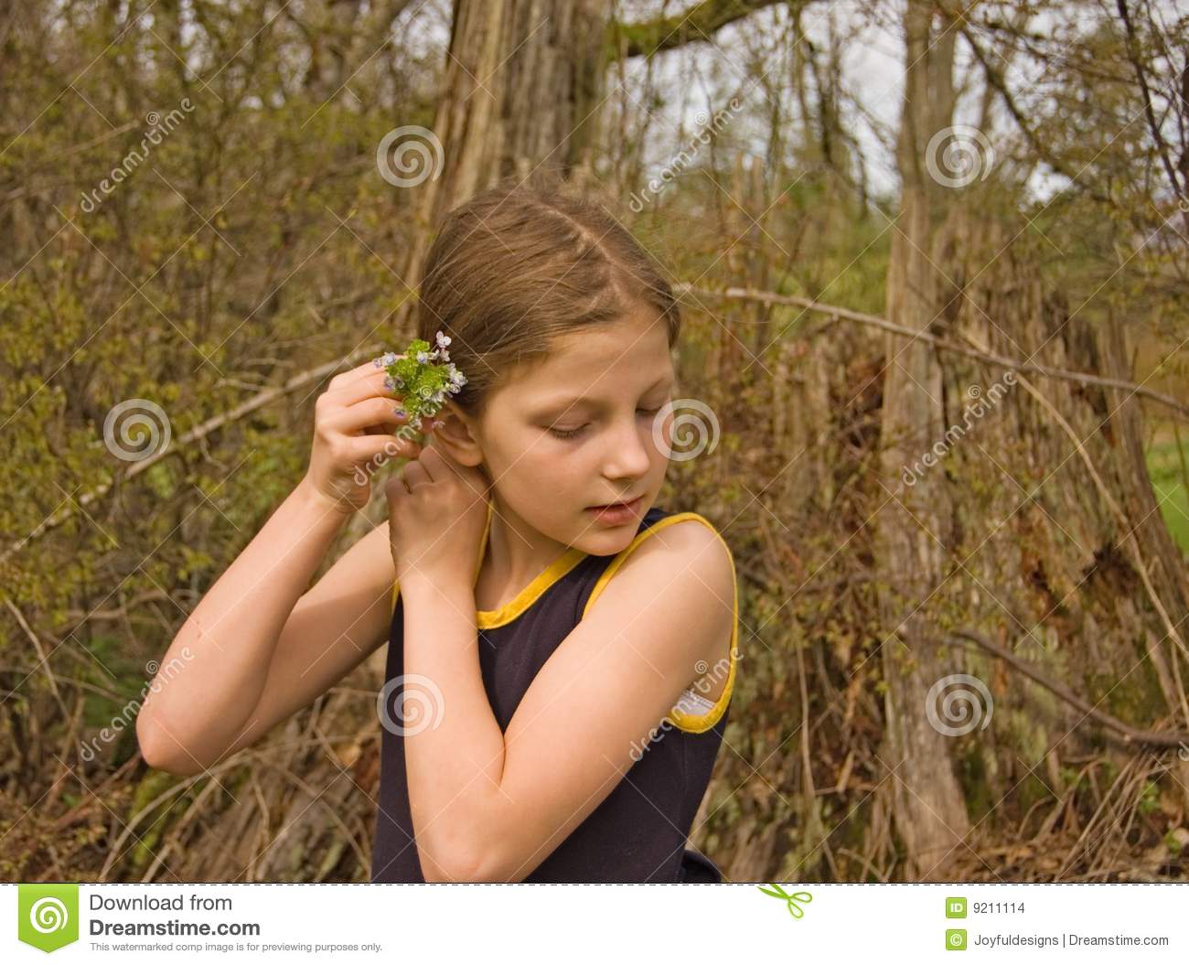 Cute 8 Year Old Girl Putting Flowers In Hair Stock Images   Image    