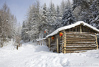 Snow Covered Lob Cabin In A Winter Forest