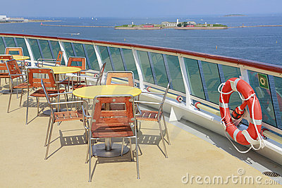 Cruise Ship Deck With Tables Chairs And Life Preserver Ring