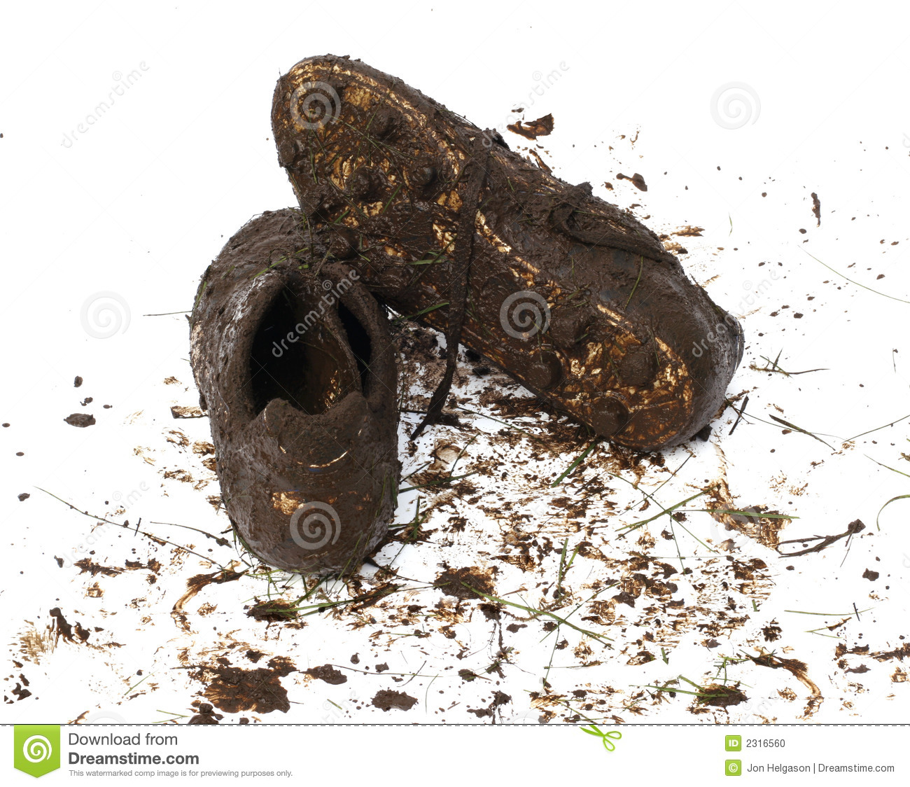 Muddy And Dirty Football Cleats Isolated On White 