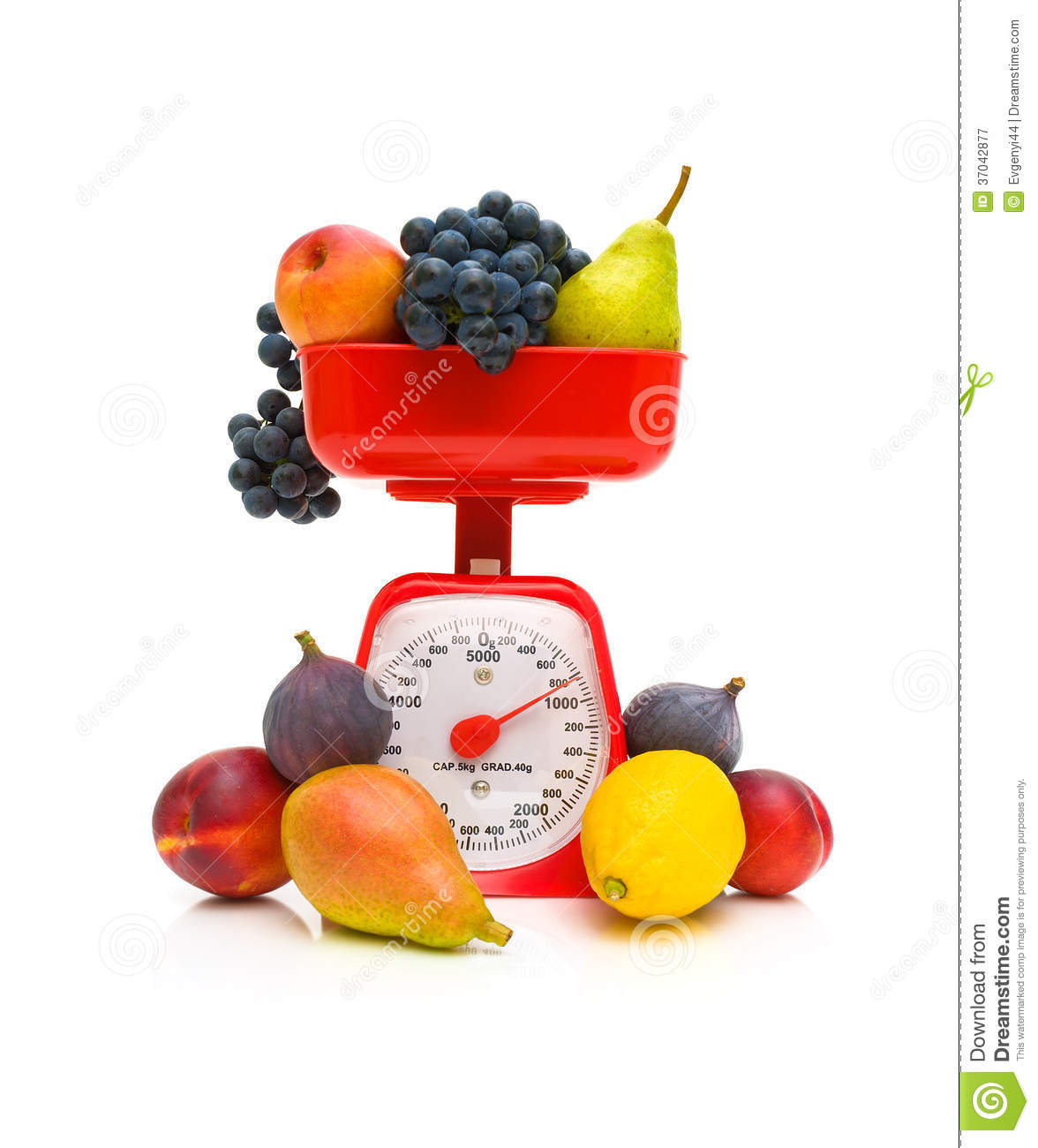 Fresh Fruits And Kitchen Scales On A White Background Close Up