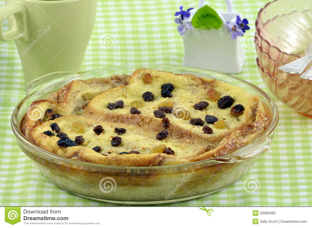 Fresh Baked Bread And Butter Pudding With Raisins On Green Checked