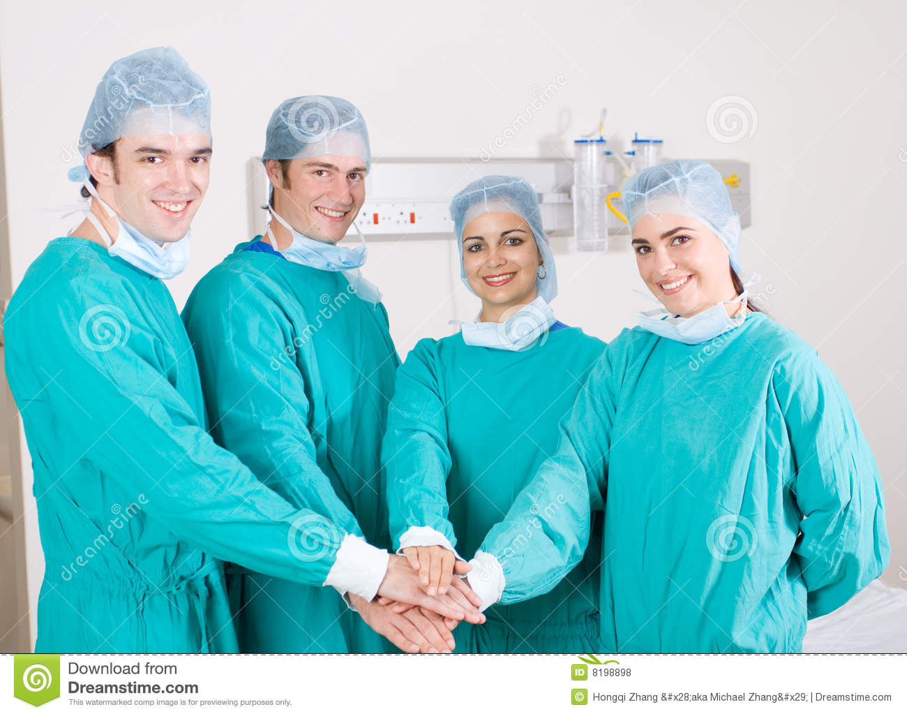 Medical Doctors With Hands Together To Form A Medical Teamwork