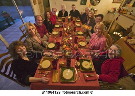 Stock Photograph Of Guests At An Elegant Thanksgiving Dinner Party    
