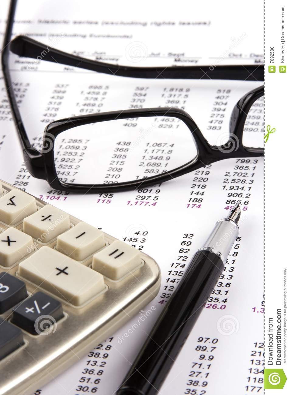 Financial Statement With Calculator Eyeglasses And Fountain Pen