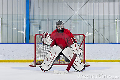 Ice Hockey Goalie In Front Of His Net  Picture Taken In Arena 
