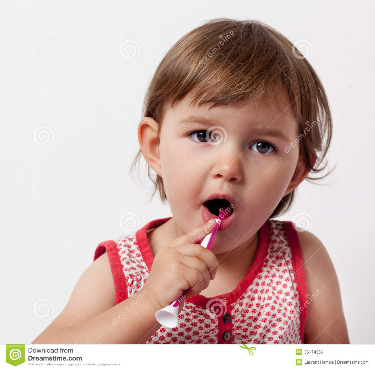 Baby Learning To Care About Her Teeth With Toothbrush Royalty Free