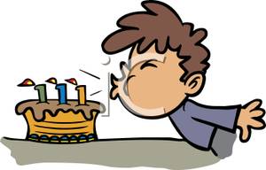     Boy Blowing Out His Birthday Candles   Royalty Free Clipart Picture