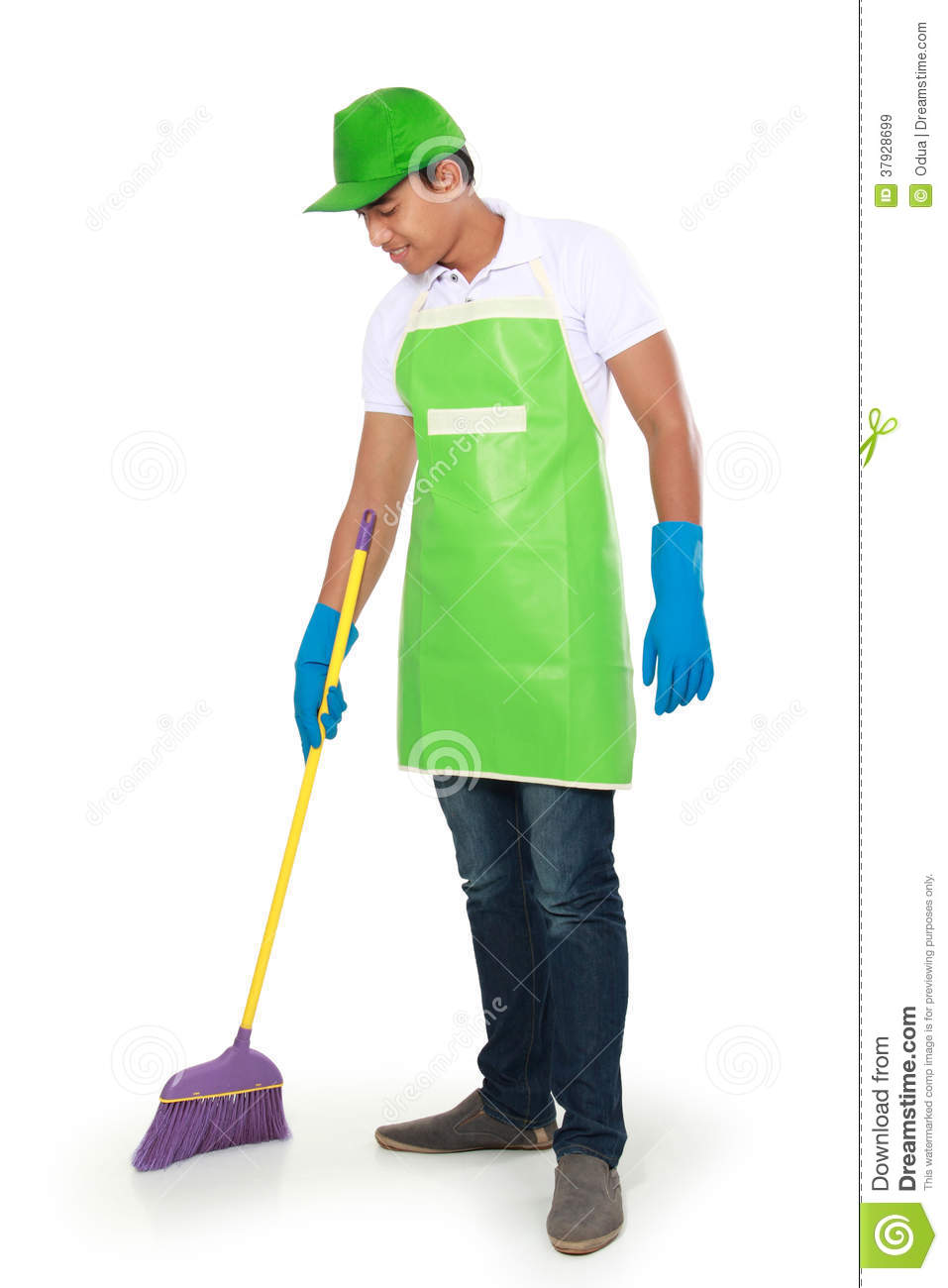 Portrait Of Young Man With Cleaning Equipment  Sweeping The Floor