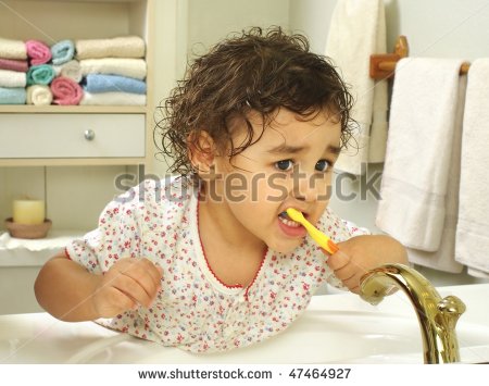 Two Year Old Girl Brushing Teeth In Bathroom Stock Photo 47464927