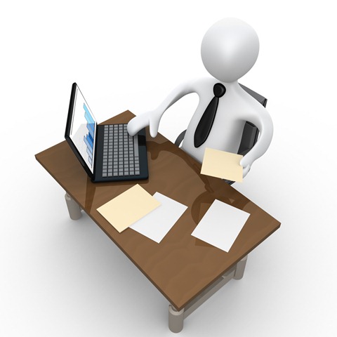 Clipart Illustration Of A White Employee Seated At A Wooden Desk And
