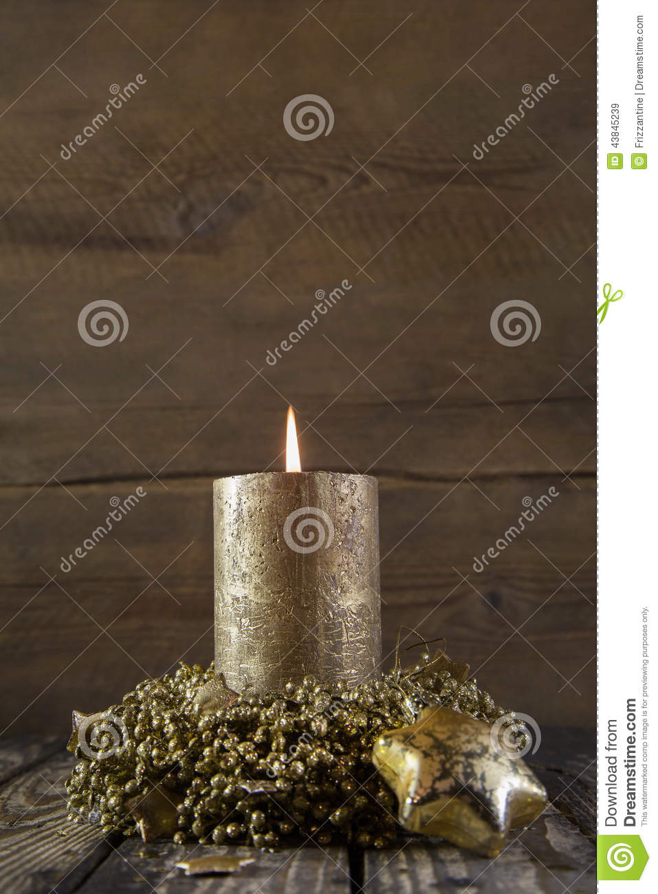 One Burning Golden Advent Candle On Wooden Rustic Background  Stock