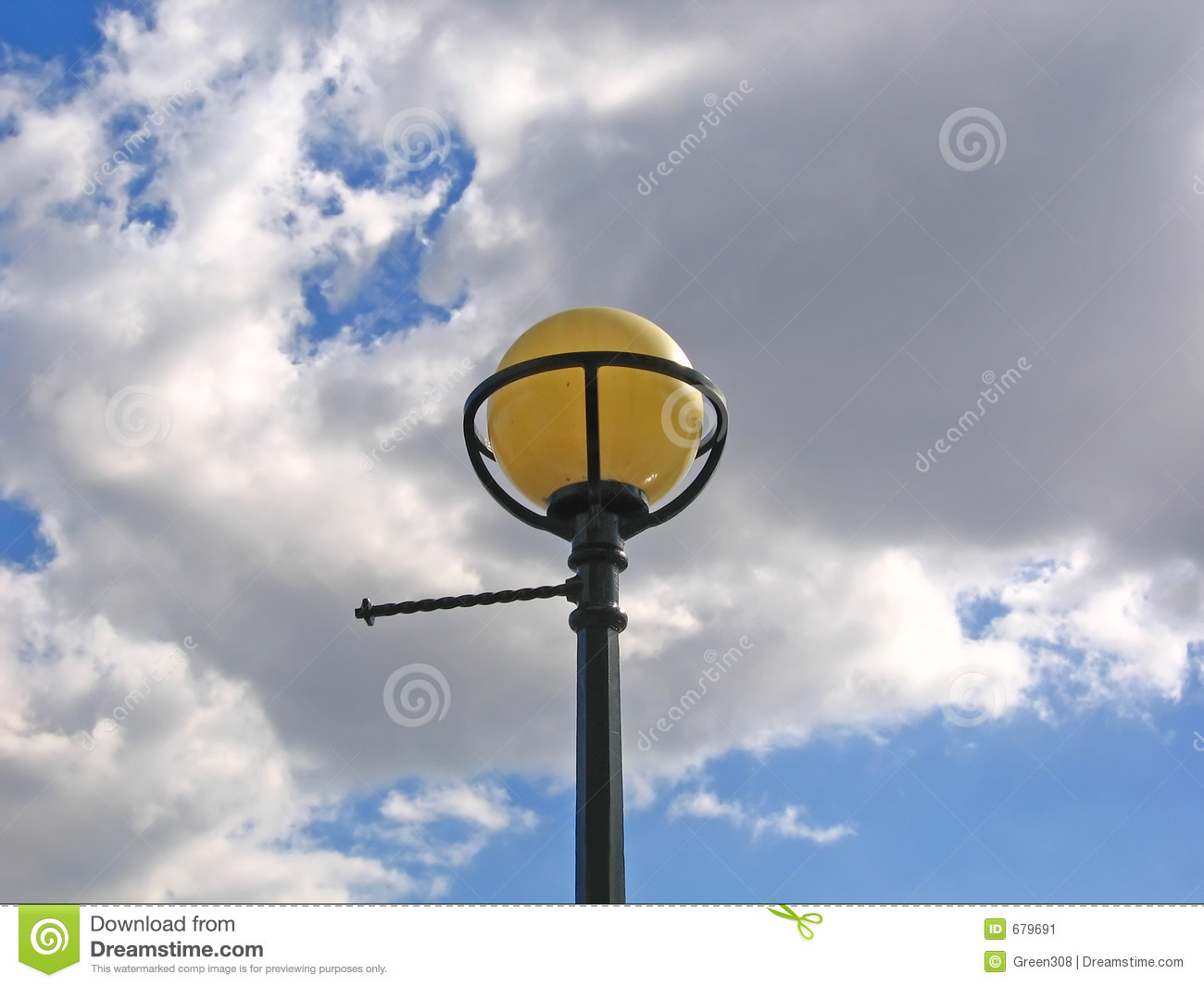 Old Fashioned Globe Street Lamp Against A Cloudy Blue Sky In England 
