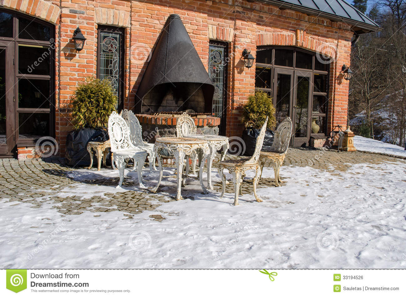 Retro Decorative Outdoor Table And Chairs Near Restaurant Fireplace
