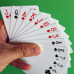 Hand Holding A Number Of Playing Cards
