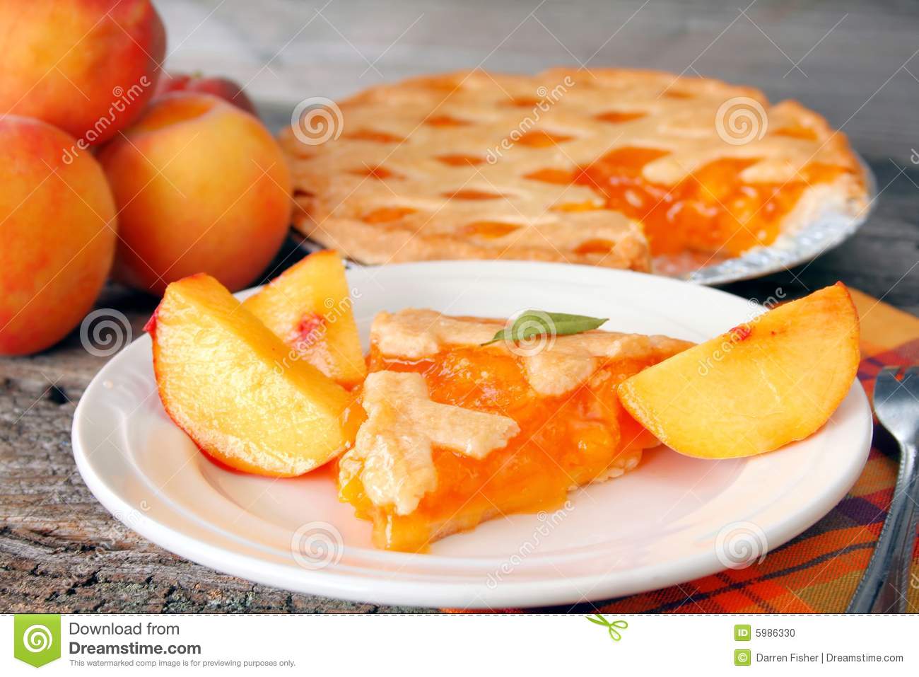 Slice Of Peach Pie With The Pie In The Background And Fresh    