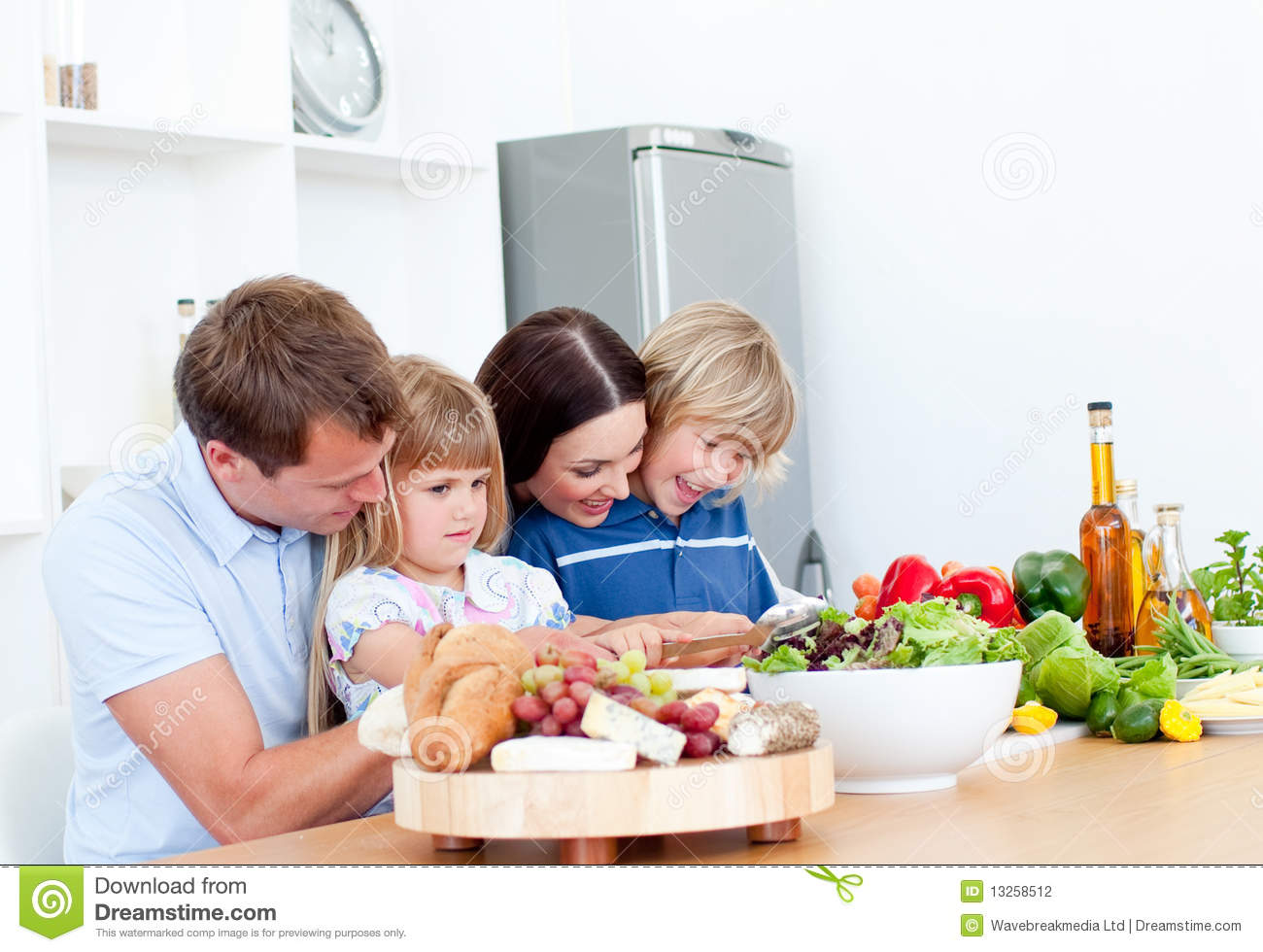 Jolly Young Family Cooking Together Stock Photography   Image