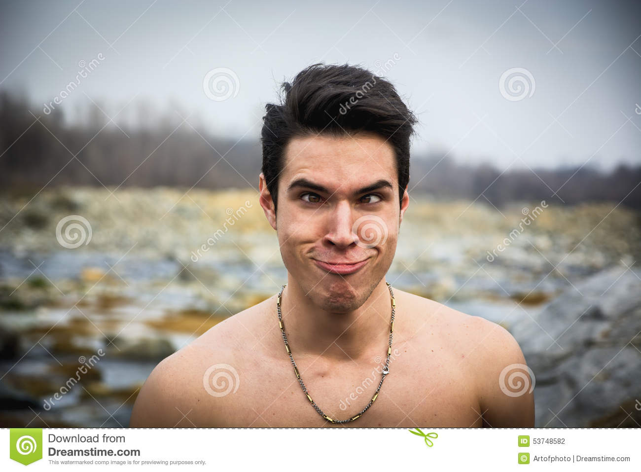 Man Outdoor Doing Silly Face And Stupid Expression Looking At Camera