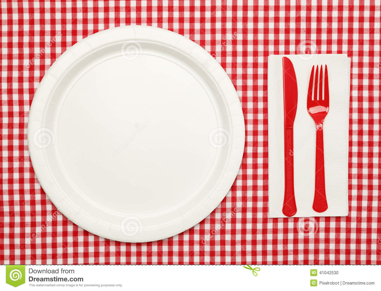 Paper Plate On Red Checkered Table Cloth Wtih Plastic Utnesils And