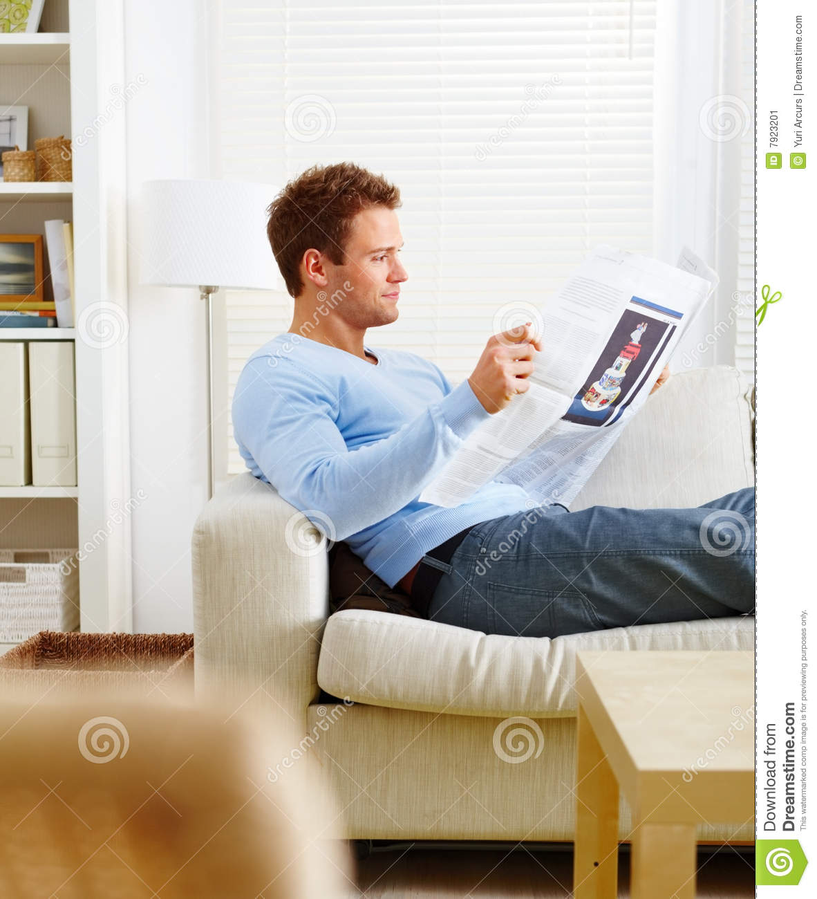 Stock Image  Man Lying On Couch Reading Newspaper  Image  7923201