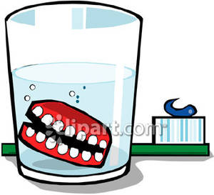 Dentures And A Toothbrush   Royalty Free Clipart Picture