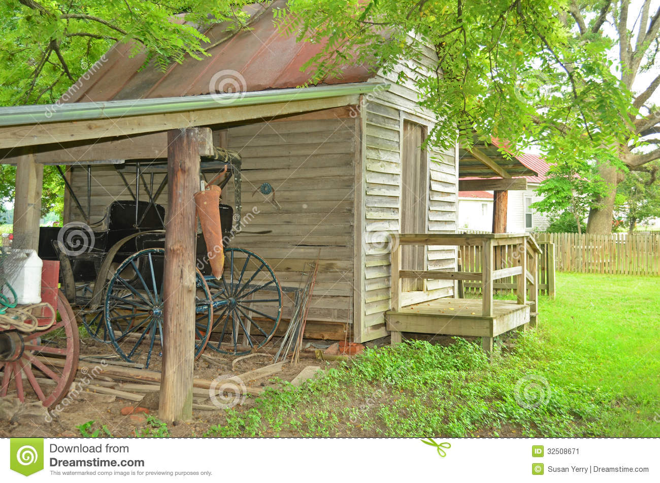 Small Old Wooden Shed With Shelter Covering A Antique Horse Carriage