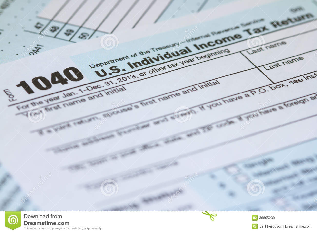 Photo Of A 2013 1040 Irs Tax Form Laying On Second Page Of Form