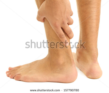 Young Man With Leg Pain Isolated On White   Stock Photo